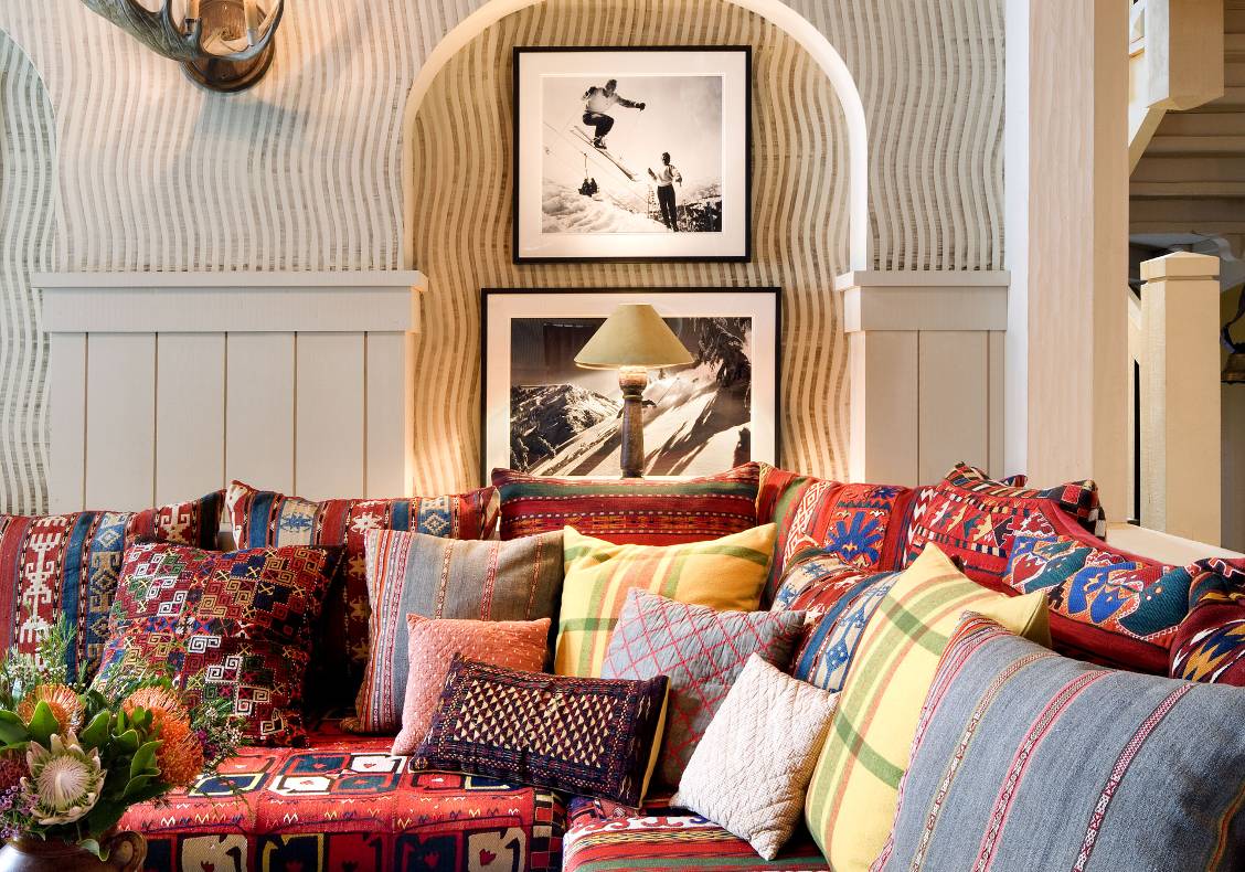 View of great room sunken seating area with pillows.