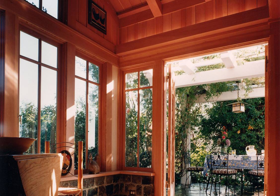 The French doors lead to the garden and a shaded terrace.