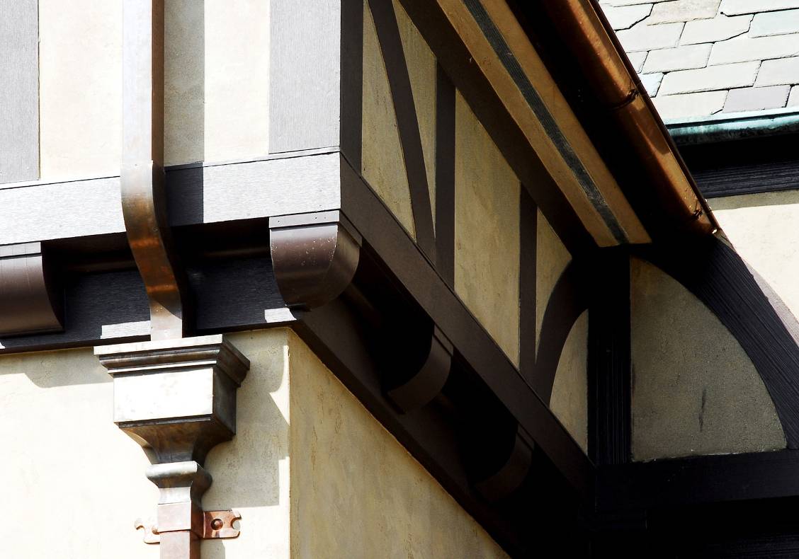 Even small details such as the metal downspouts and exterior light designs bring a great deal of character to the country club as a whole.