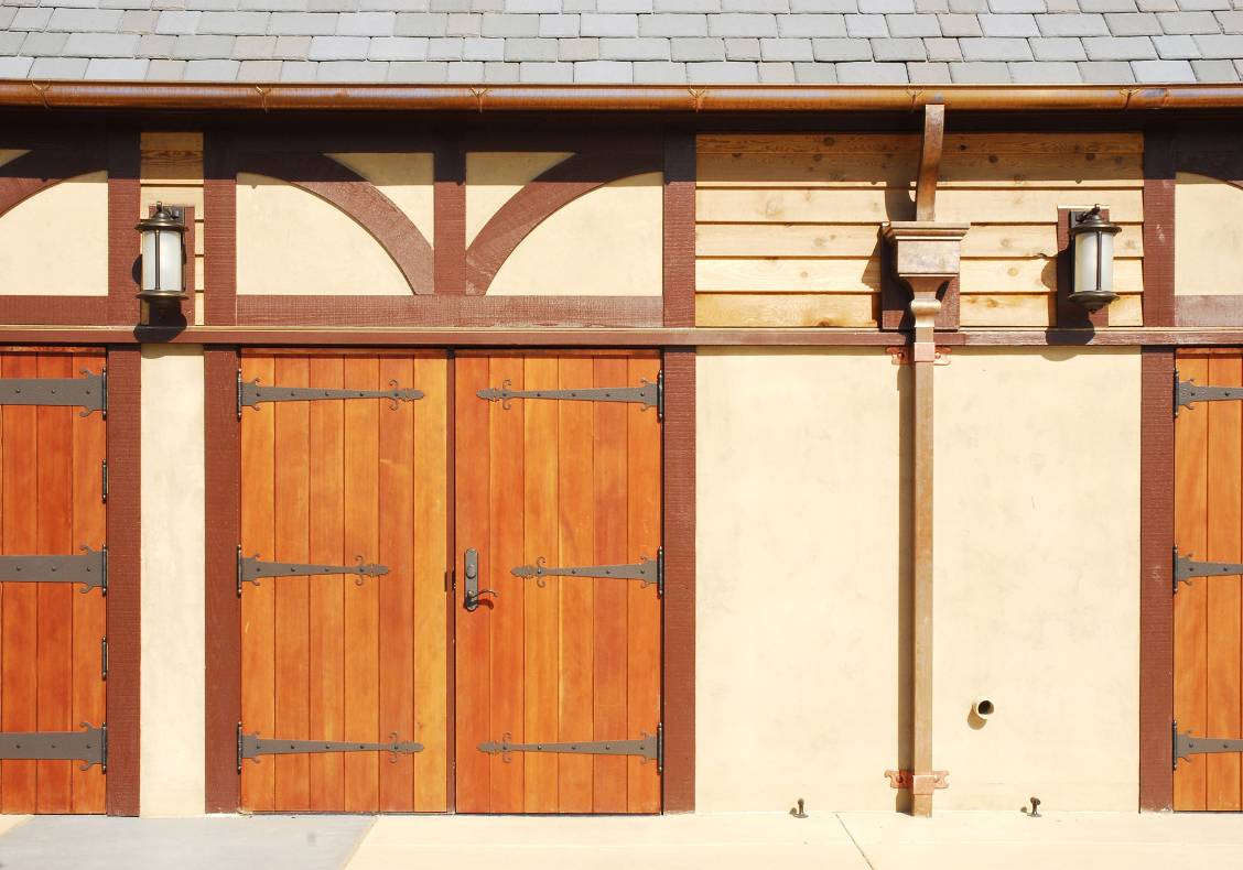 The Aquatic Center's pool house design echoes an equestrian tradition in its splendid display of half-timbering and wooden barn door detailing.