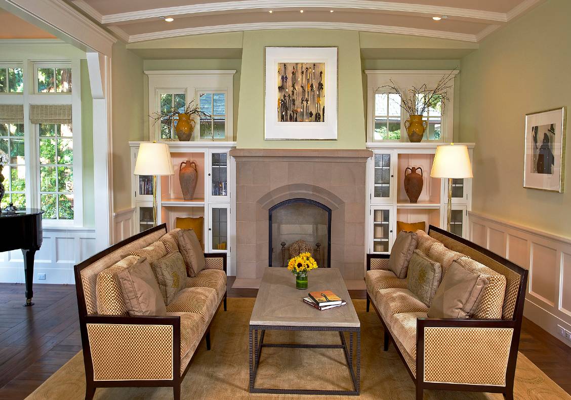 Living room with vaulted ceiling, cast stone fireplace, glazed music bay.