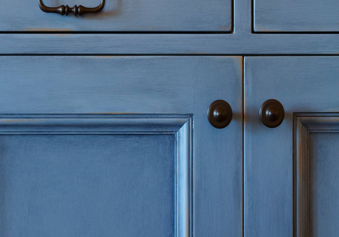 The kitchen cabinets have varied finishes.