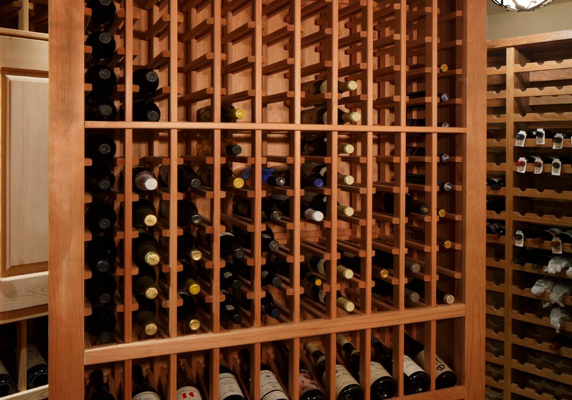 For special guests, the owner pivots out one of the wine cellar's redwood wine racks to reveal a secret chamber for the safekeeping of special vintages.