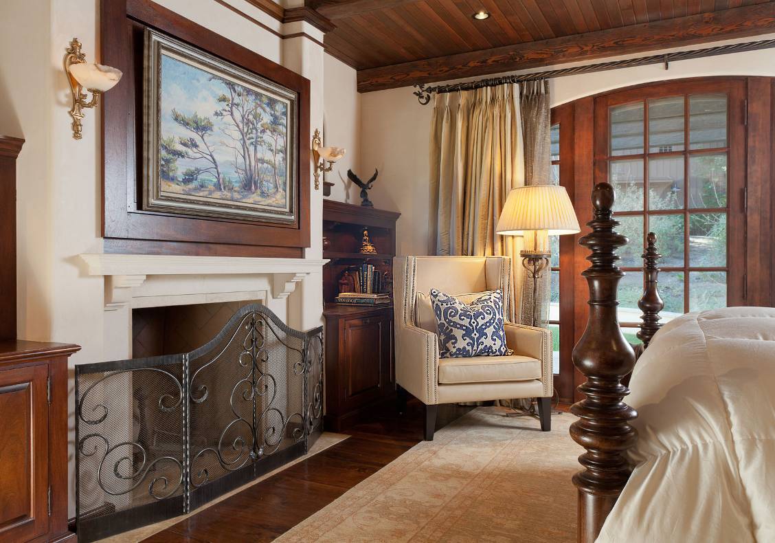 In the master bedroom the picture over the mantel rotates to reveal a television behind.