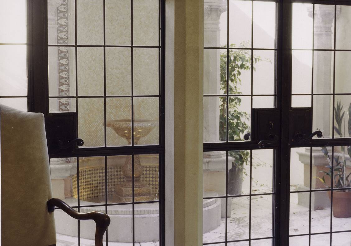 French doors open the breakfast room out to the kitchen courtyard.
