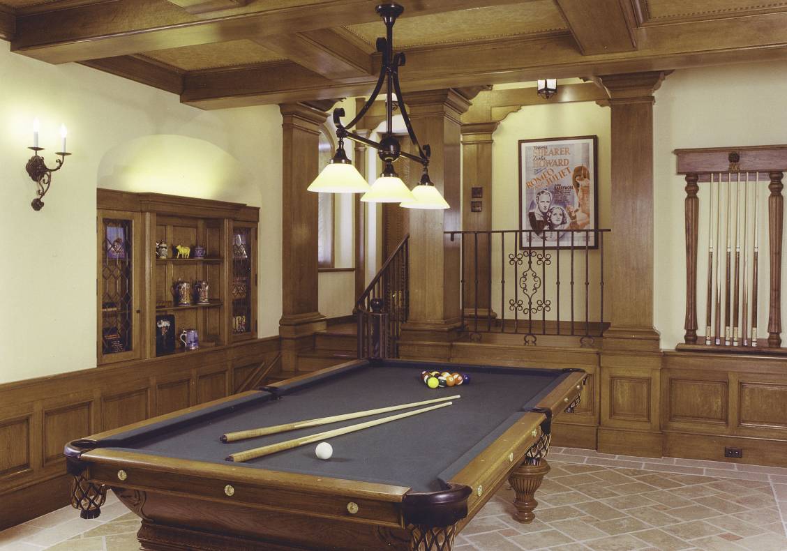 THe billiard room has a wood wainscot and leather ceiling