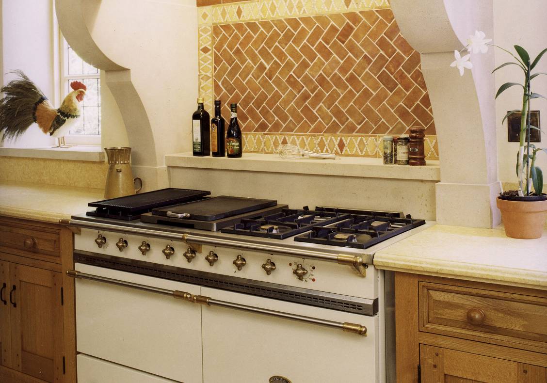 The range has a stone hood and windows to either side.