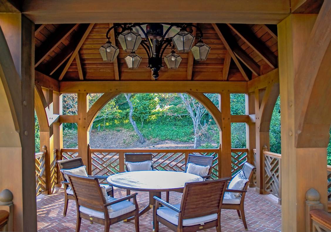 The tower gazebo has an outdoor loggia equipped with a gas radiant heating system integrated into a lantern chandelier.