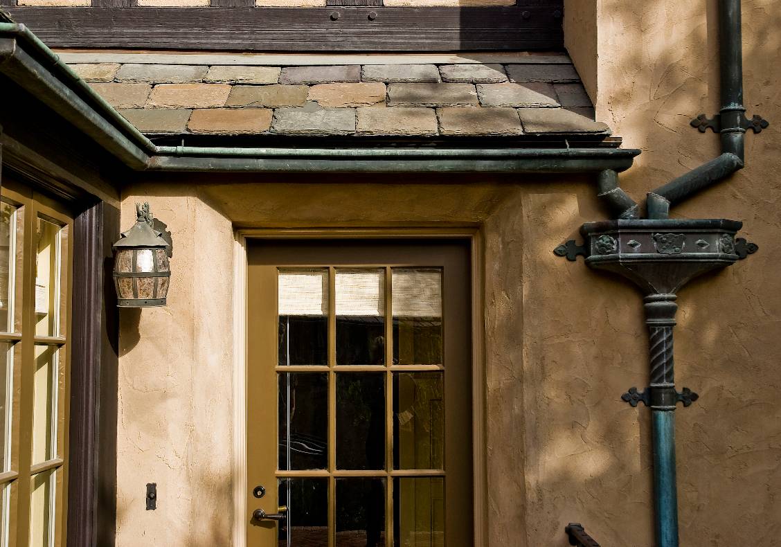 Slate roofs, verdigris copper gutters, downspouts and leader heads