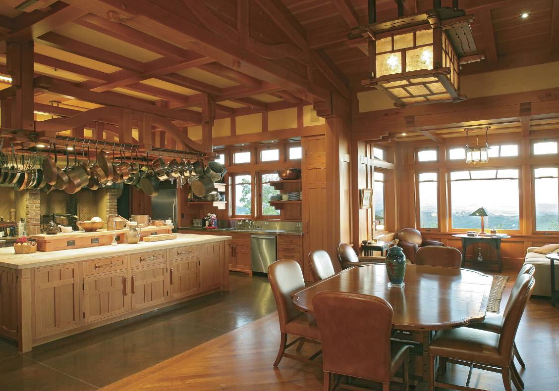 Custom made lantern hangs over the dining table.  The chef's kitchen overlooks the main space with large windows overlooking Dry Creek Valley in rural Healdsburg.