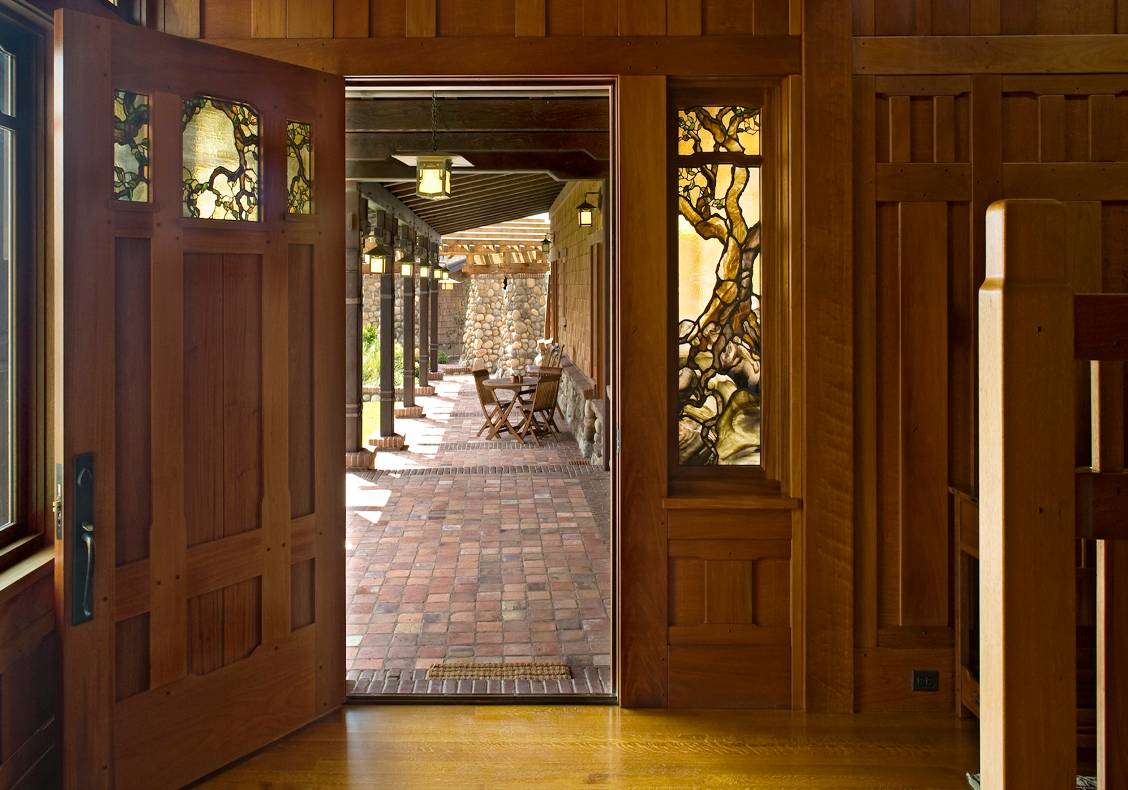 Fiddleback mahogany paneling and frames gives the entry hall a richness.  The stair is lit with clearstory windows which bath the space in natural light.
